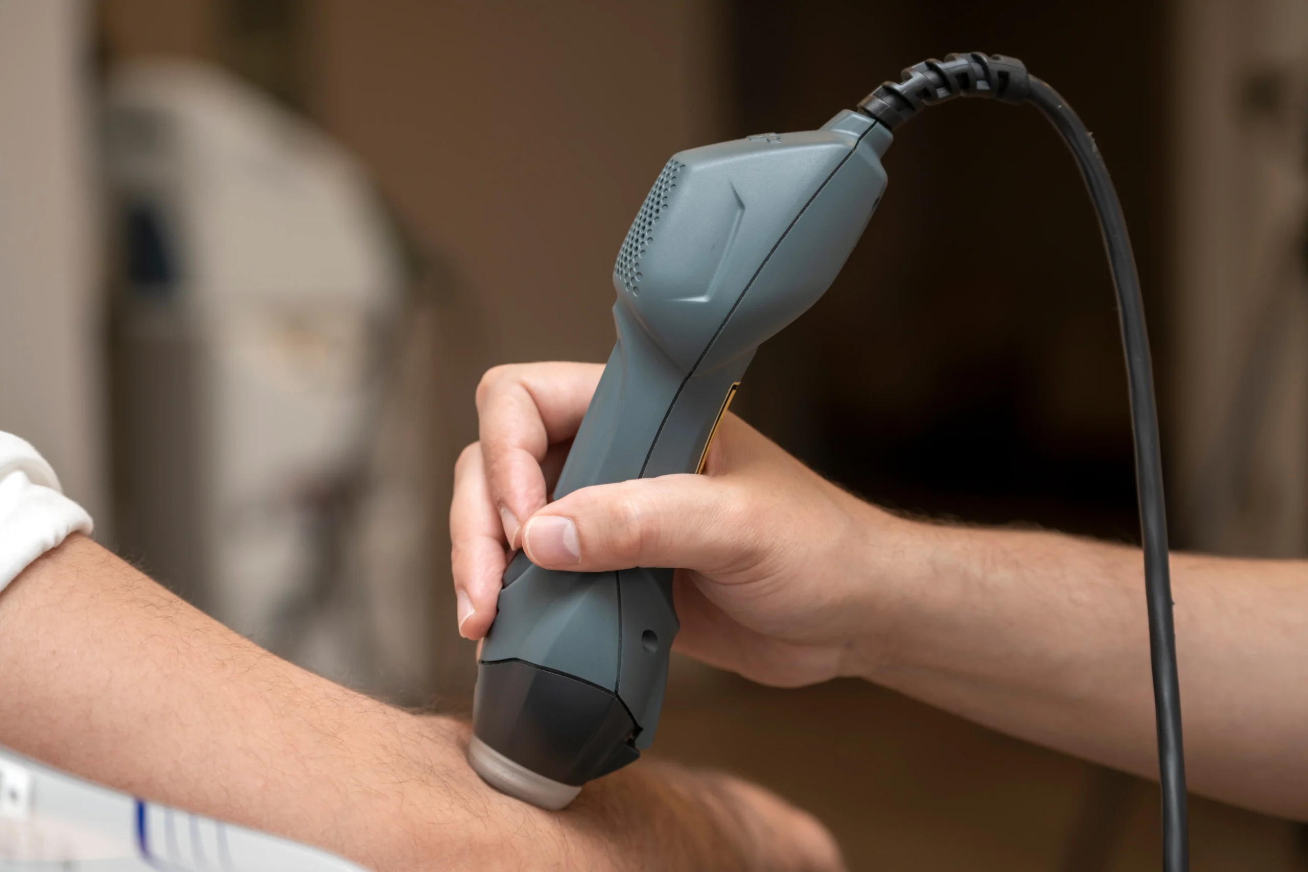 Family Practice of Chiropractic using cold laser therapy on a patient.