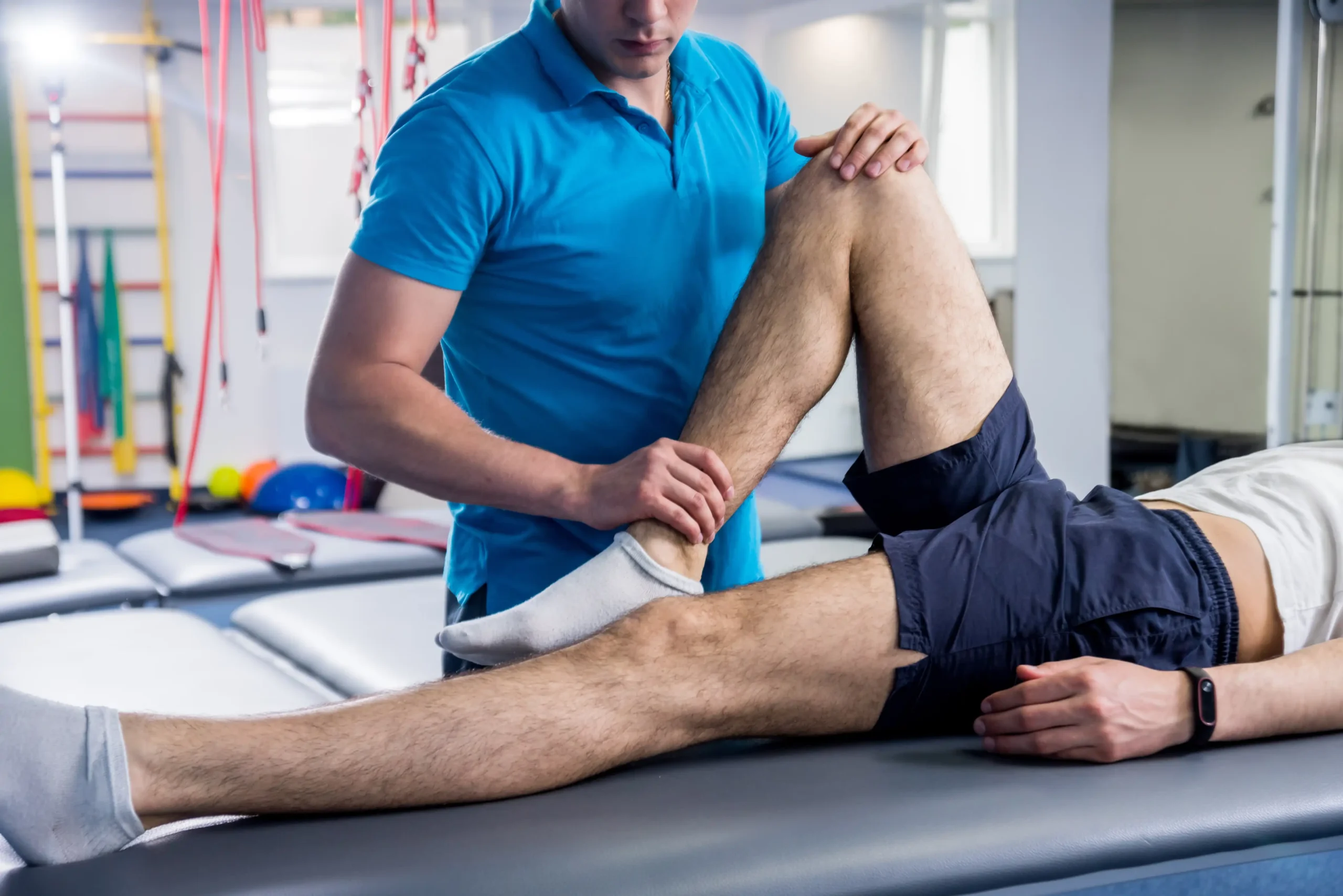 A Chapin, SC sports chiropractor treating an athlete's knee injury.